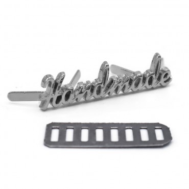 Placchetta handmade in metallo con alette 35x8mm