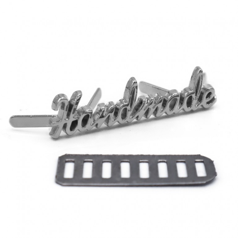 Placchetta handmade in metallo con alette 35x8mm