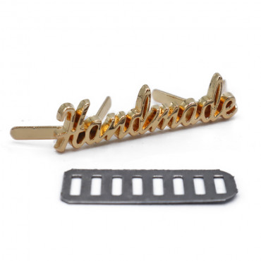 Placchetta handmade in metallo con alette 35x8mm Oro